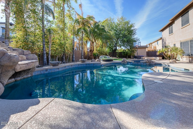 view of swimming pool with a patio area