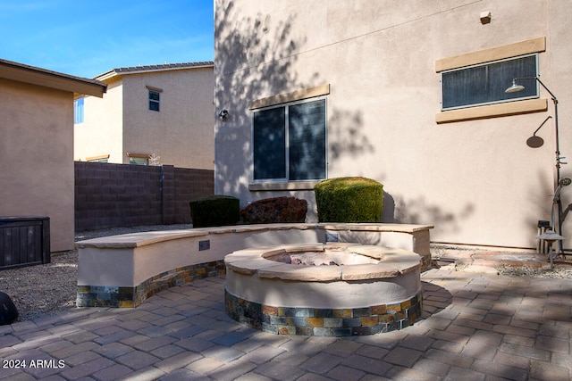 view of patio / terrace featuring an outdoor fire pit