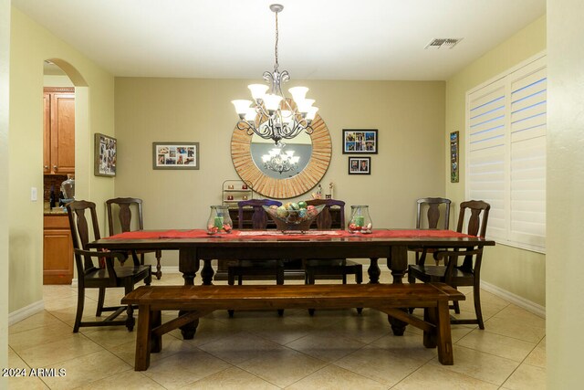 dining space with a chandelier