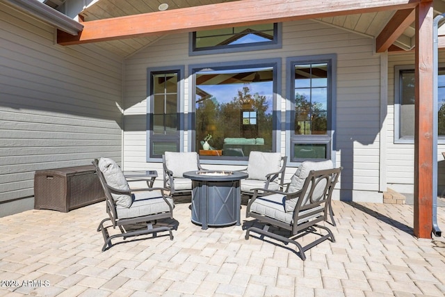 view of patio with a fire pit