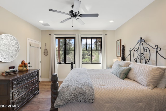 bedroom with ceiling fan and dark hardwood / wood-style flooring