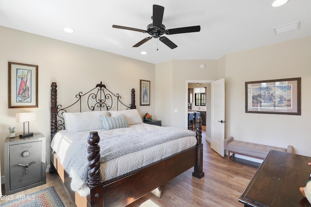 bedroom with light hardwood / wood-style floors and ceiling fan