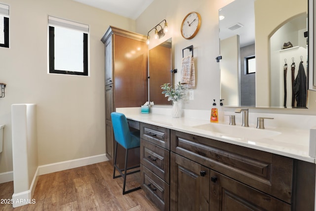 bathroom featuring vanity and hardwood / wood-style floors