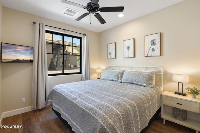 bedroom featuring dark wood-type flooring and ceiling fan