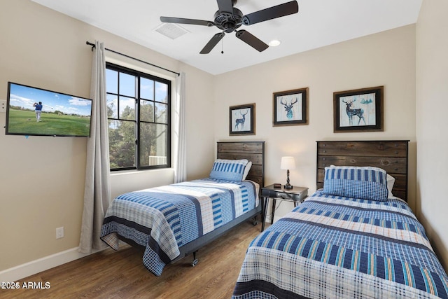 bedroom with hardwood / wood-style floors and ceiling fan