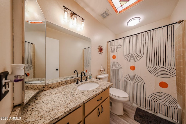 1500 N Markdale Unit 68, Mesa, AZ 85201 - bathroom with toilet, vanity, wood finished floors, and a shower with curtain