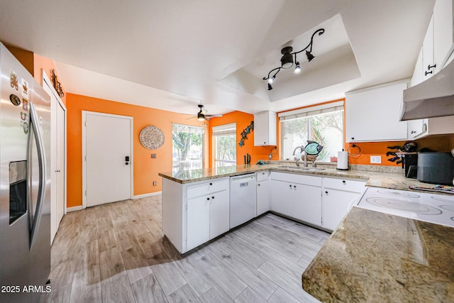 1500 N Markdale Unit 68, Mesa, AZ 85201 - kitchen with white dishwasher, stainless steel fridge, a raised ceiling, a sink, and a peninsula