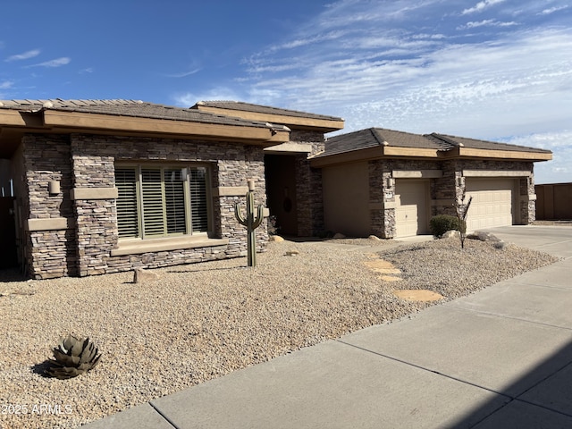 prairie-style home featuring a garage