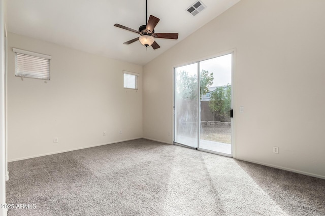 empty room featuring carpet floors, vaulted ceiling, and ceiling fan