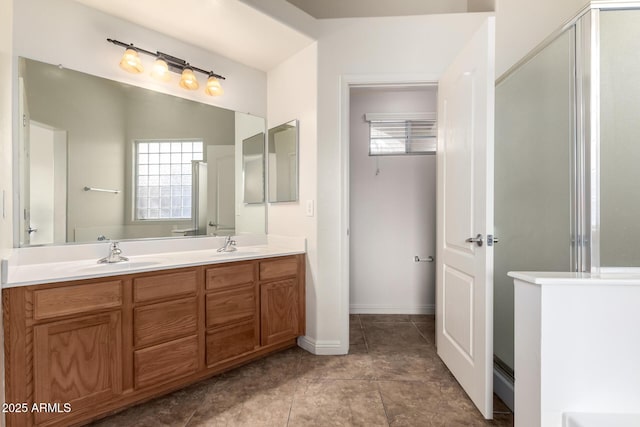 bathroom featuring vanity and a shower with shower door