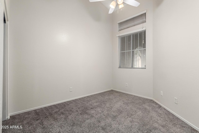 carpeted empty room with ceiling fan