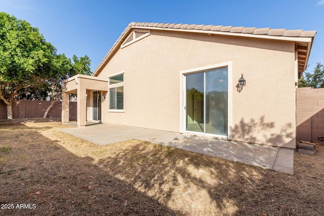 rear view of house featuring a patio