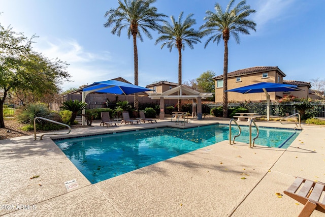 view of swimming pool featuring a patio area