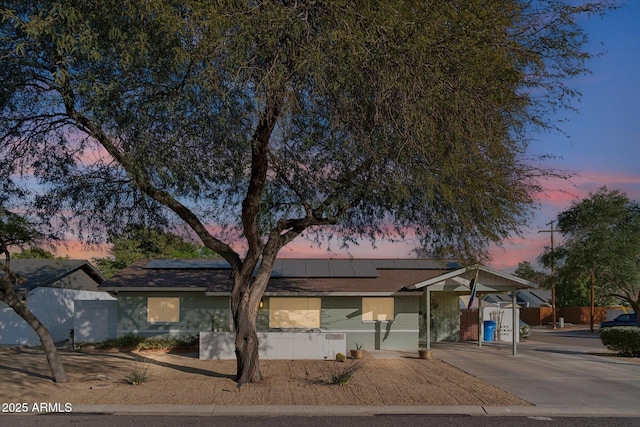 view of front of house featuring solar panels