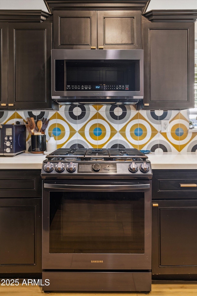 kitchen with stainless steel appliances and dark brown cabinets