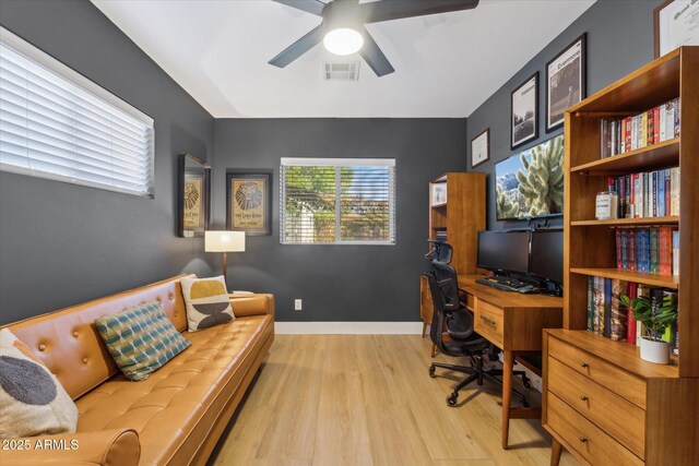 office area with light hardwood / wood-style floors and ceiling fan