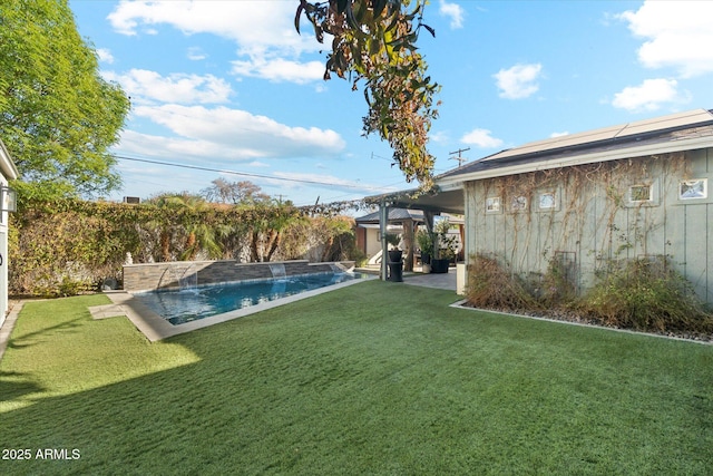 view of yard featuring pool water feature, a fenced in pool, and a patio area