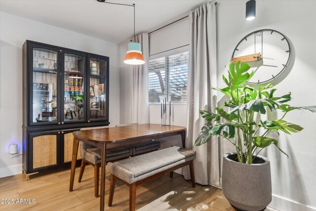 dining room with hardwood / wood-style floors