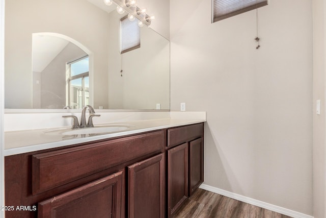 bathroom featuring vanity and hardwood / wood-style floors