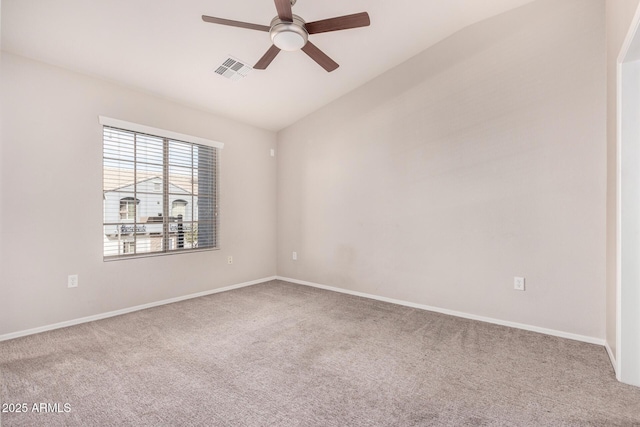 carpeted empty room with ceiling fan and vaulted ceiling