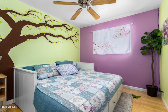 bedroom featuring light wood-type flooring, ceiling fan, and baseboards