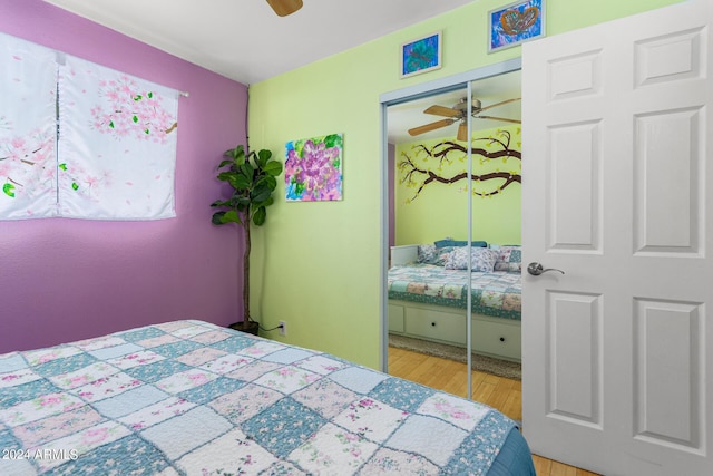 bedroom with a closet, ceiling fan, and wood finished floors