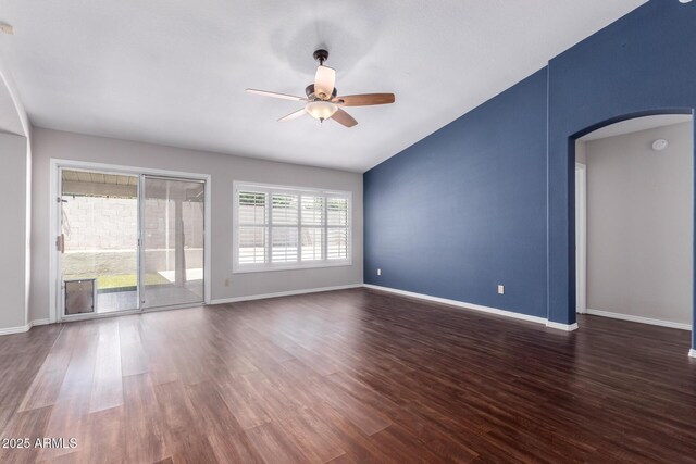 8500 W Saint John Rd, Peoria, AZ 85382 - unfurnished room with arched walkways, lofted ceiling, a ceiling fan, dark wood-style floors, and baseboards