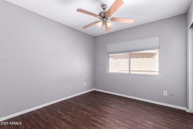 8500 W Saint John Rd, Peoria, AZ 85382 - spare room featuring wood finished floors, baseboards, and a ceiling fan