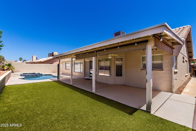 8500 W Saint John Rd, Peoria, AZ 85382 - back of property with a patio, a pool with connected hot tub, and concrete block siding