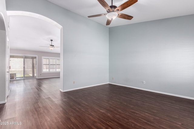 8500 W Saint John Rd, Peoria, AZ 85382 - unfurnished room with ceiling fan, arched walkways, dark wood finished floors, and baseboards
