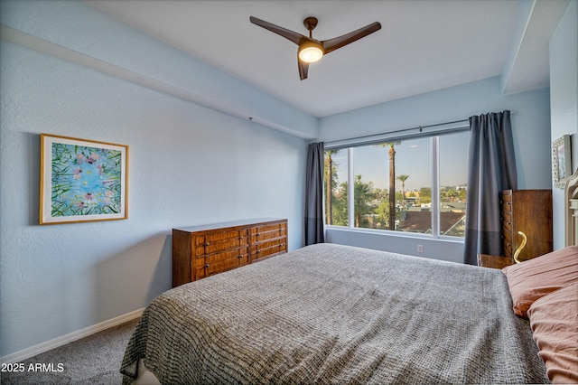 bedroom with ceiling fan and carpet