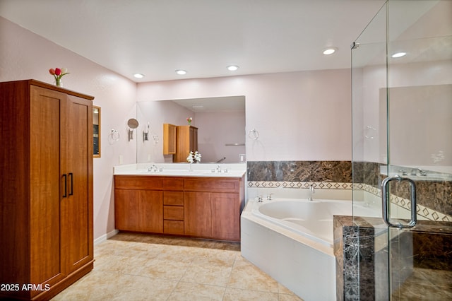 bathroom featuring separate shower and tub, tile patterned floors, and vanity