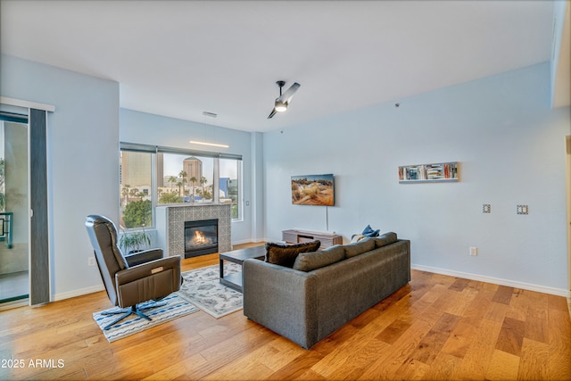 living room featuring a fireplace and light hardwood / wood-style floors