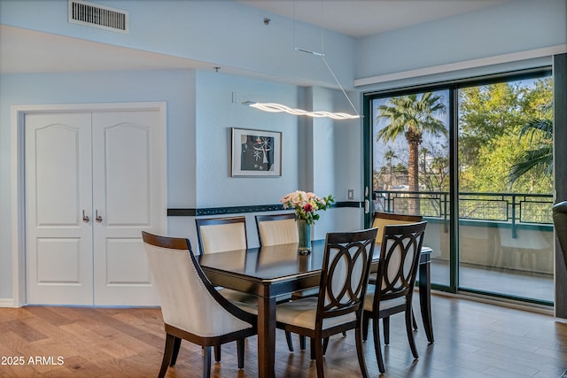 dining area with light hardwood / wood-style flooring