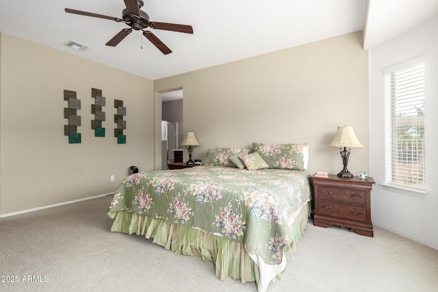 bedroom with visible vents, carpet floors, baseboards, and a ceiling fan