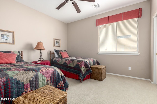 bedroom with carpet flooring, baseboards, visible vents, and ceiling fan