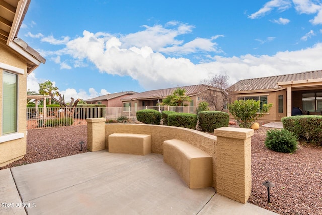 view of patio featuring fence