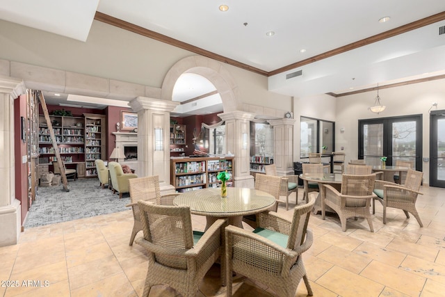 dining space with light tile patterned floors, visible vents, ornate columns, and ornamental molding