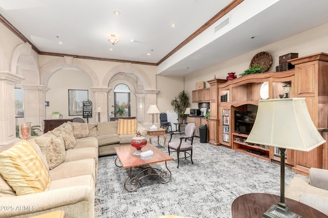 living room featuring visible vents, ornate columns, recessed lighting, arched walkways, and crown molding