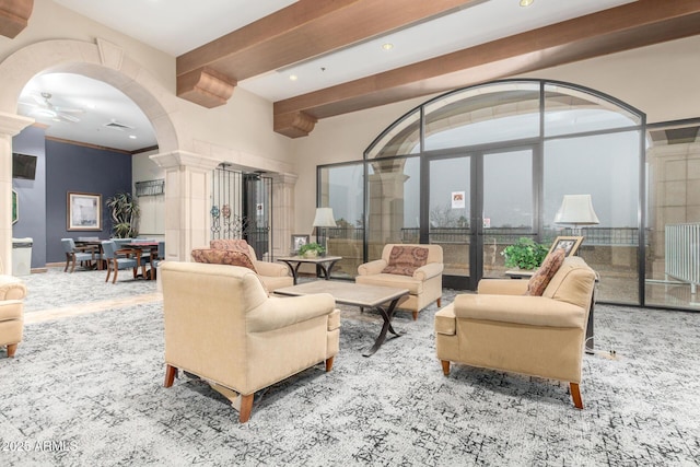 living area featuring decorative columns, beam ceiling, recessed lighting, french doors, and a ceiling fan