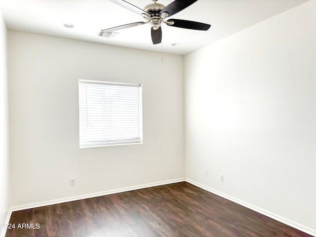 8940 W Olive Ave Unit 134, Peoria, AZ 85345 - empty room with dark wood-style flooring, ceiling fan, and baseboards