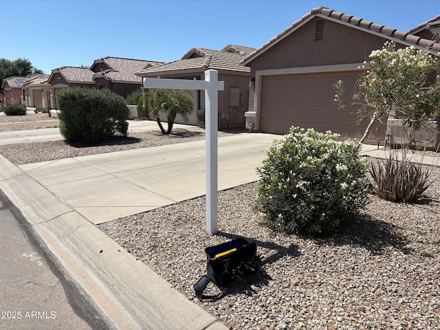 2738 E Silversmith Trl, San Tan Valley, AZ 85143 - ranch-style house with a tile roof, a garage, driveway, and stucco siding