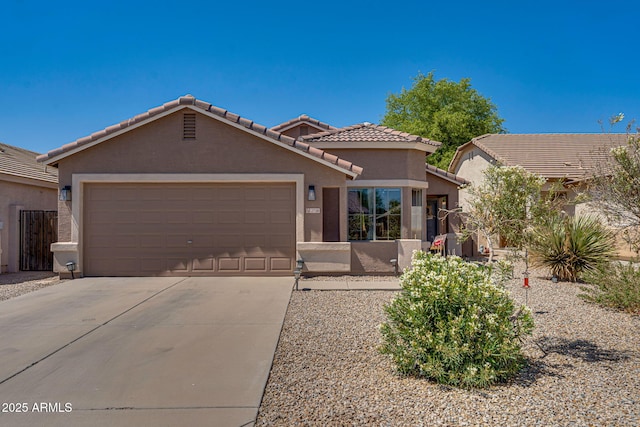 2738 E Silversmith Trl, San Tan Valley, AZ 85143 - view of front of property featuring stucco siding, an attached garage, a tiled roof, and concrete driveway