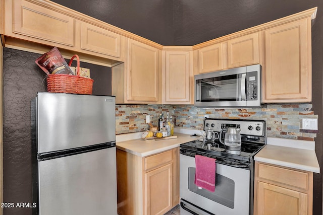 2738 E Silversmith Trl, San Tan Valley, AZ 85143 - kitchen with appliances with stainless steel finishes, light brown cabinets, light countertops, and decorative backsplash