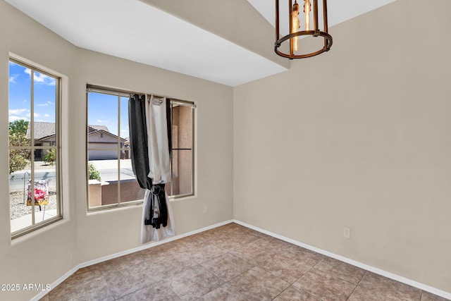 2738 E Silversmith Trl, San Tan Valley, AZ 85143 - tiled empty room featuring a chandelier, healthy amount of natural light, and baseboards