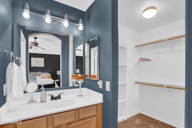 2738 E Silversmith Trl, San Tan Valley, AZ 85143 - full bathroom featuring a ceiling fan, vanity, and a walk in closet