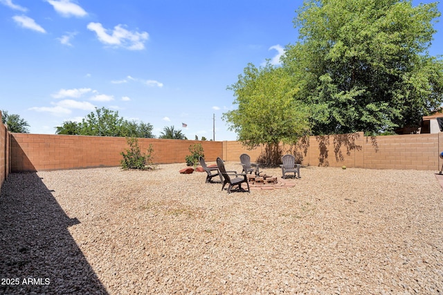 2738 E Silversmith Trl, San Tan Valley, AZ 85143 - fenced backyard featuring a fire pit
