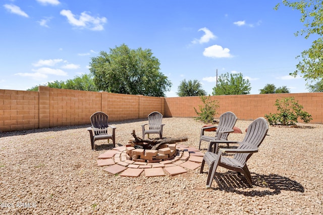 2738 E Silversmith Trl, San Tan Valley, AZ 85143 - fenced backyard featuring an outdoor fire pit