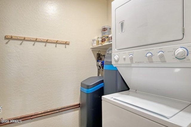 washroom featuring stacked washer and dryer