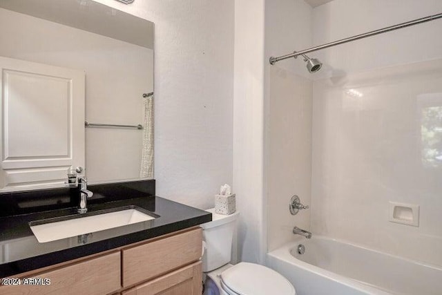 full bathroom with shower / washtub combination, vanity, and toilet